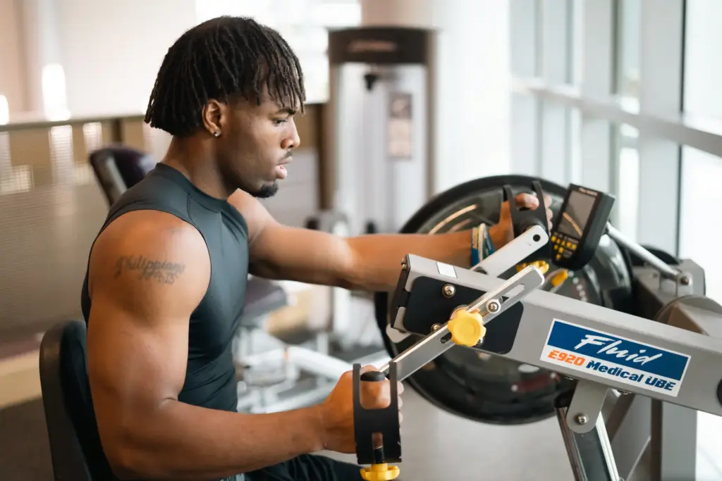 a man uses fitness equipment